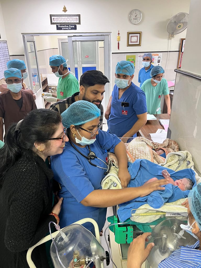 Happy international patient with Indian doctor after treatment