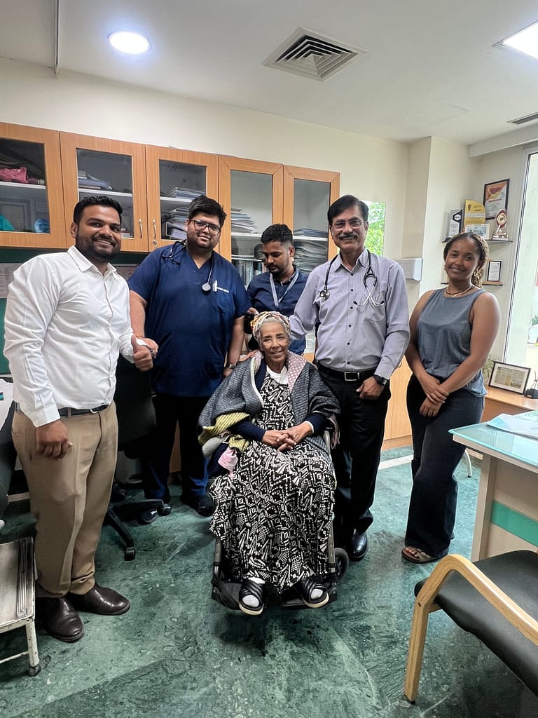 International patient with doctors and LWE Patient Care team in India